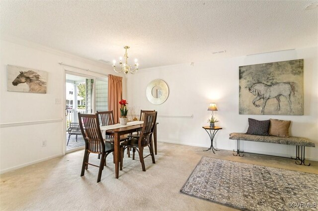 262 Claiborne Dr, Williamsburg, VA 23185 - carpeted dining area with a chandelier, a textured ceiling, and ornamental molding