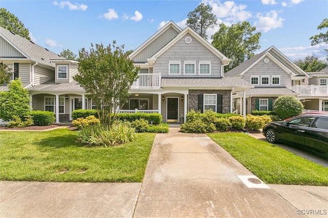 262 Claiborne Dr, Williamsburg, VA 23185 - view of front facade with a front lawn, a porch, and stone siding