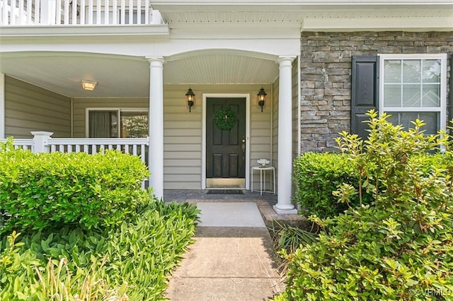 262 Claiborne Dr, Williamsburg, VA 23185 - doorway to property with stone siding and a porch