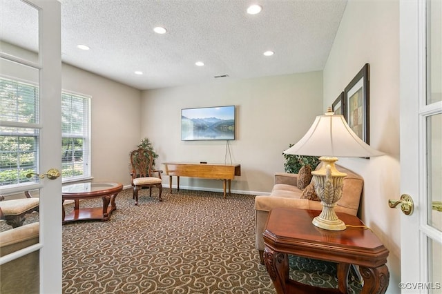 262 Claiborne Dr, Williamsburg, VA 23185 - living area with a textured ceiling, carpet, and recessed lighting