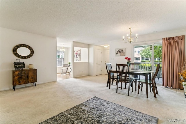 262 Claiborne Dr, Williamsburg, VA 23185 - dining space featuring a chandelier, carpet floors, plenty of natural light, and a textured ceiling