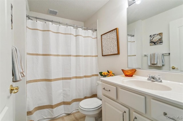 262 Claiborne Dr, Williamsburg, VA 23185 - bathroom featuring vanity, a textured ceiling, and curtained shower
