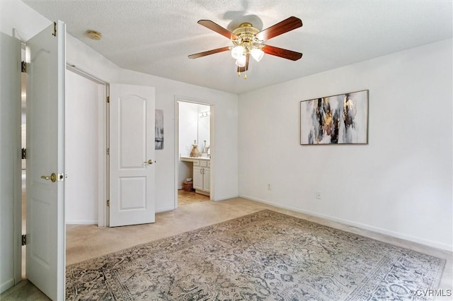 262 Claiborne Dr, Williamsburg, VA 23185 - unfurnished bedroom featuring light carpet, ensuite bathroom, and a ceiling fan
