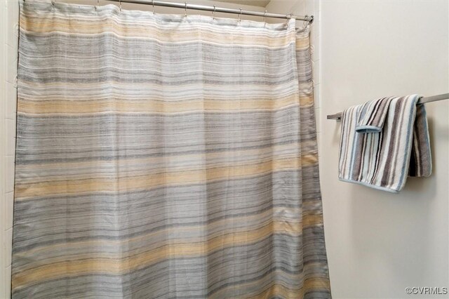262 Claiborne Dr, Williamsburg, VA 23185 - bathroom featuring a shower with shower curtain
