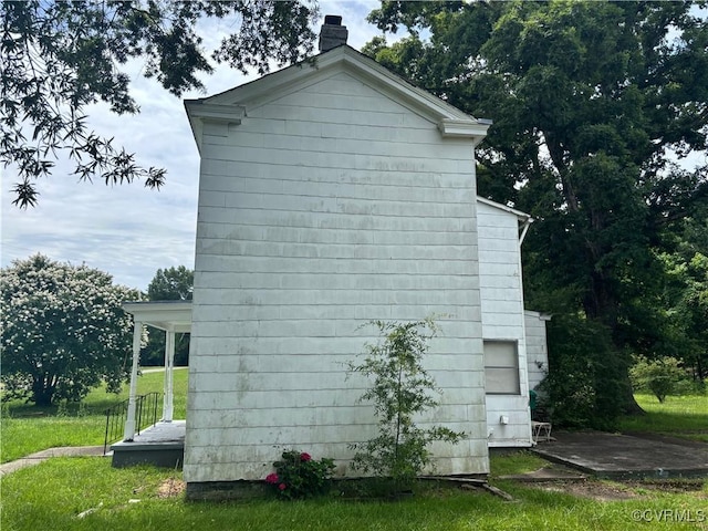 6690 4th Ave, Henrico, VA 23231 - view of home's exterior featuring a chimney