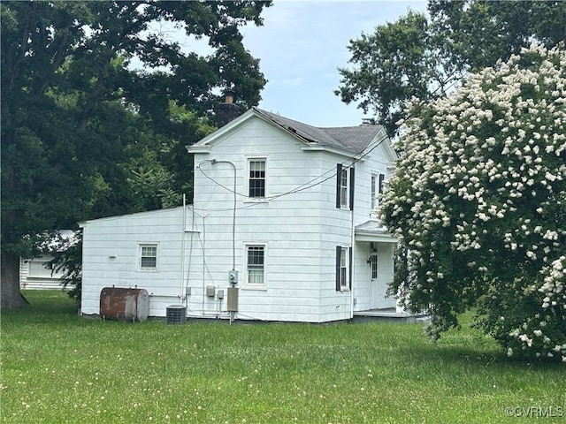 6690 4th Ave, Henrico, VA 23231 - rear view of property with a yard and heating fuel