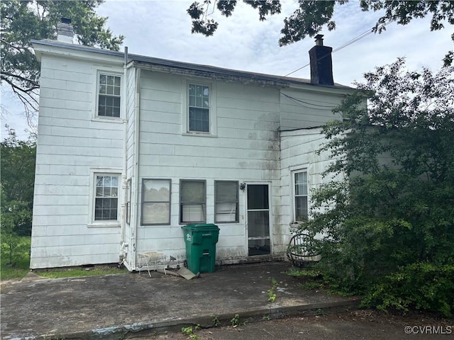 6690 4th Ave, Henrico, VA 23231 - back of house with a chimney