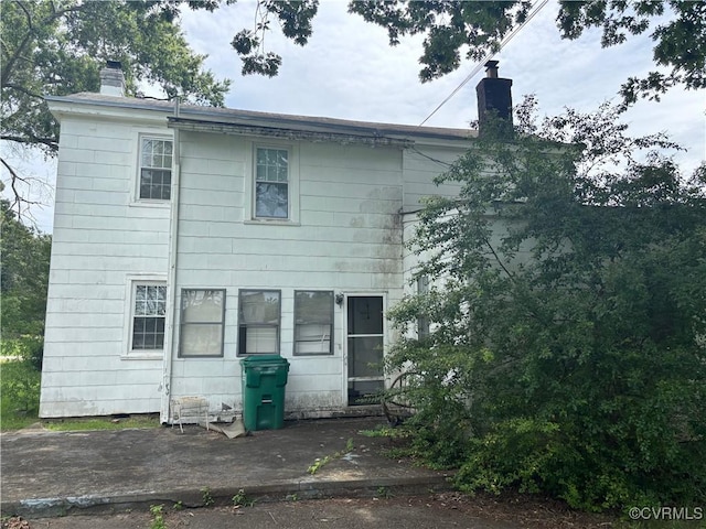 6690 4th Ave, Henrico, VA 23231 - rear view of house with a chimney