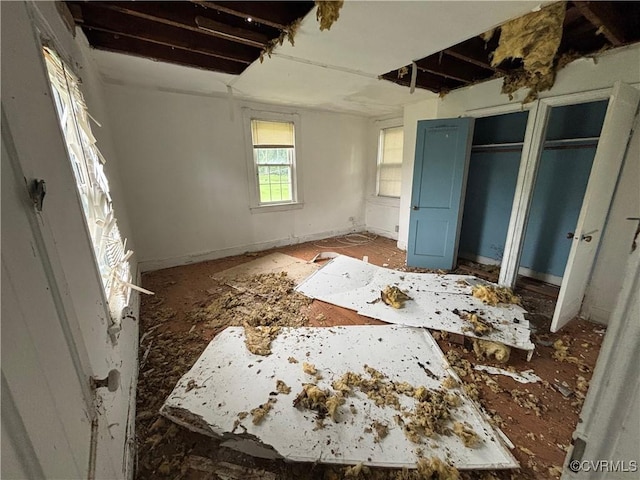 6690 4th Ave, Henrico, VA 23231 - unfurnished bedroom featuring multiple closets