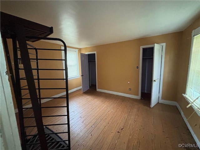 6690 4th Ave, Henrico, VA 23231 - unfurnished bedroom featuring light wood finished floors