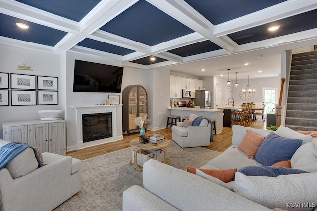 6504 Sanford Springs Cv, Midlothian, VA 23112 - living room with stairway, coffered ceiling, light wood finished floors, a fireplace, and beamed ceiling