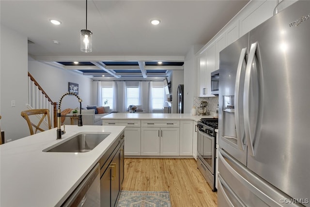6504 Sanford Springs Cv, Midlothian, VA 23112 - kitchen with appliances with stainless steel finishes, coffered ceiling, recessed lighting, light wood-style flooring, and light countertops