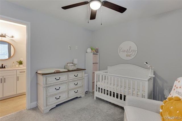 6504 Sanford Springs Cv, Midlothian, VA 23112 - bedroom featuring light colored carpet, a ceiling fan, a nursery area, and ensuite bathroom