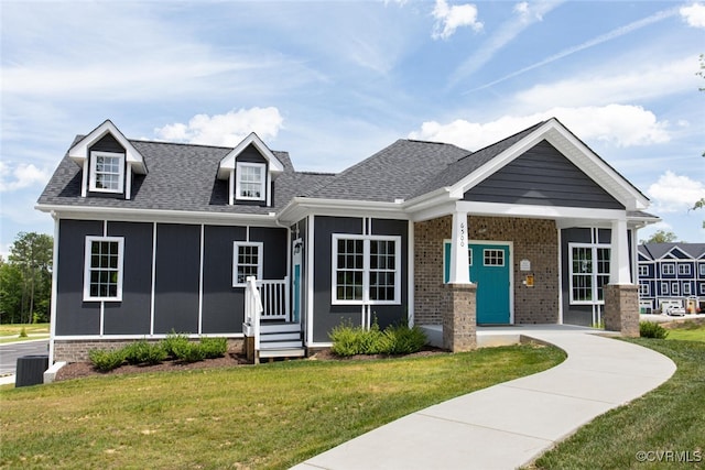 6504 Sanford Springs Cv, Midlothian, VA 23112 - view of front of house featuring a front yard, roof with shingles, and brick siding