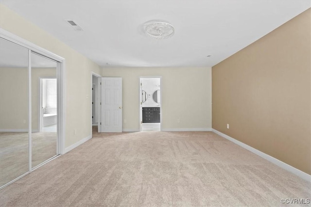 13713 Nile Rd, Chester, VA 23831 - unfurnished bedroom featuring light colored carpet and ensuite bathroom