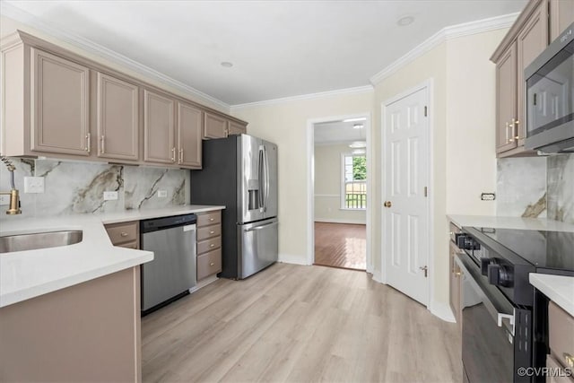 13713 Nile Rd, Chester, VA 23831 - kitchen featuring stainless steel appliances, crown molding, light wood finished floors, tasteful backsplash, and light countertops