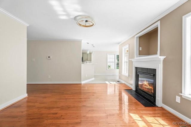 13713 Nile Rd, Chester, VA 23831 - unfurnished living room with a fireplace with flush hearth, ornamental molding, and light wood-style floors