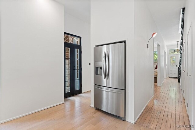 2417 E Grace St, Richmond, VA 23223 - kitchen featuring stainless steel fridge with ice dispenser and light wood-type flooring