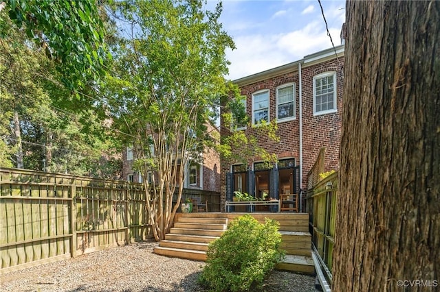 2417 E Grace St, Richmond, VA 23223 - rear view of property with brick siding and stairs