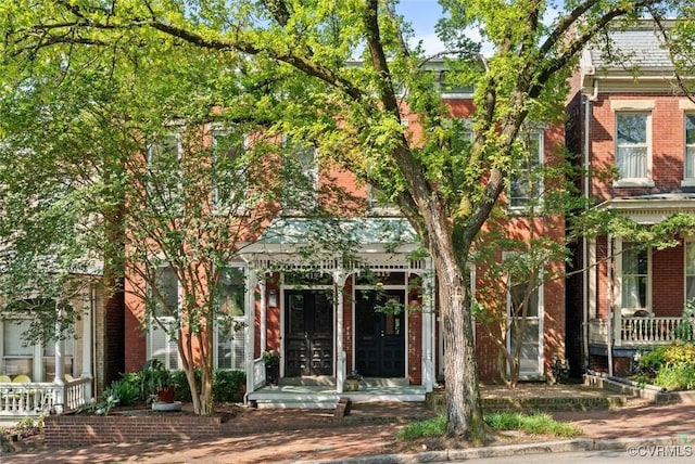 2417 E Grace St, Richmond, VA 23223 - view of front of property with brick siding and a porch