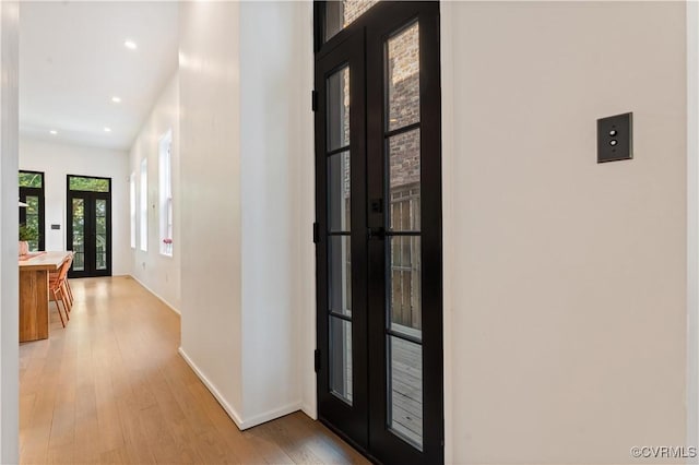 2417 E Grace St, Richmond, VA 23223 - corridor with french doors, light wood-type flooring, and recessed lighting