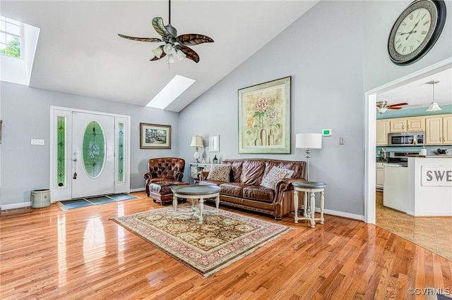 10151 W Providence Rd, North Chesterfield, VA 23236 - living room with a skylight, a ceiling fan, high vaulted ceiling, and light wood-style flooring