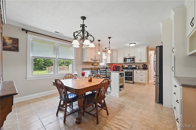 99 Oak Hill Rd, Cumberland, VA 23040 - dining area featuring light tile patterned floors, a chandelier, a textured ceiling, and ornamental molding