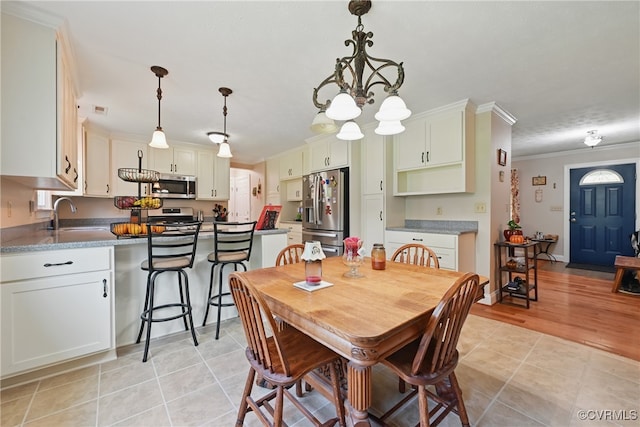99 Oak Hill Rd, Cumberland, VA 23040 - dining room with crown molding, a chandelier, and light tile patterned floors