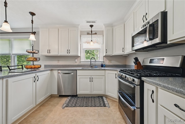 99 Oak Hill Rd, Cumberland, VA 23040 - kitchen featuring appliances with stainless steel finishes, white cabinets, hanging light fixtures, and light tile patterned flooring