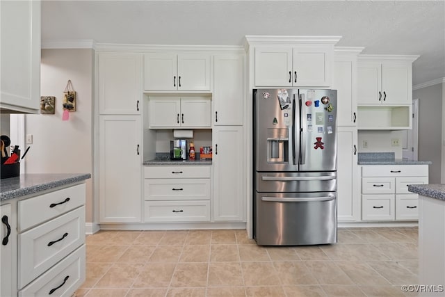 99 Oak Hill Rd, Cumberland, VA 23040 - kitchen with stainless steel refrigerator with ice dispenser, white cabinets, crown molding, and stone counters