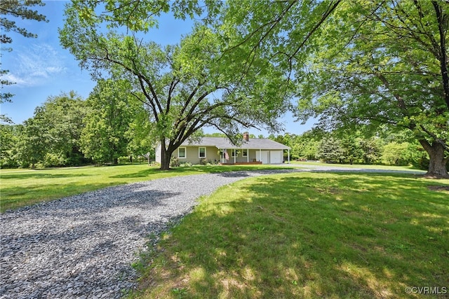 99 Oak Hill Rd, Cumberland, VA 23040 - ranch-style house with a garage, driveway, a front lawn, and a chimney