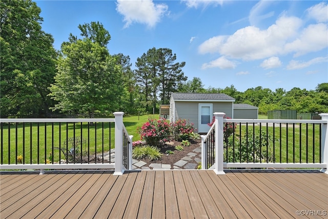 99 Oak Hill Rd, Cumberland, VA 23040 - deck featuring an outdoor structure, a lawn, and view of wooded area