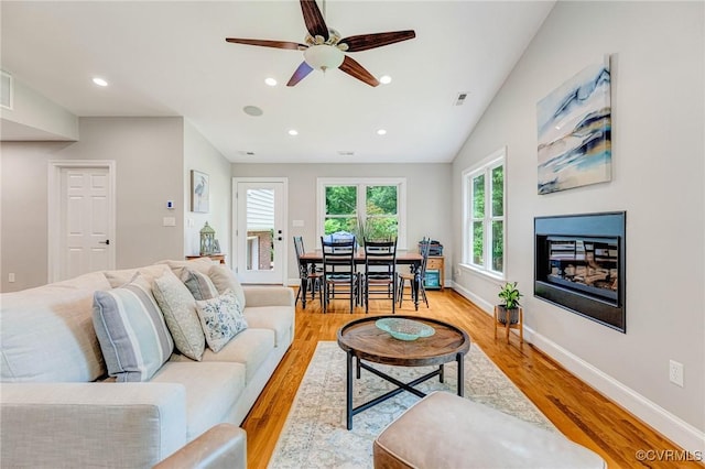 9065 Greenlake Cir, Mechanicsville, VA 23116 - living room featuring ceiling fan, light wood-type flooring, recessed lighting, and a glass covered fireplace