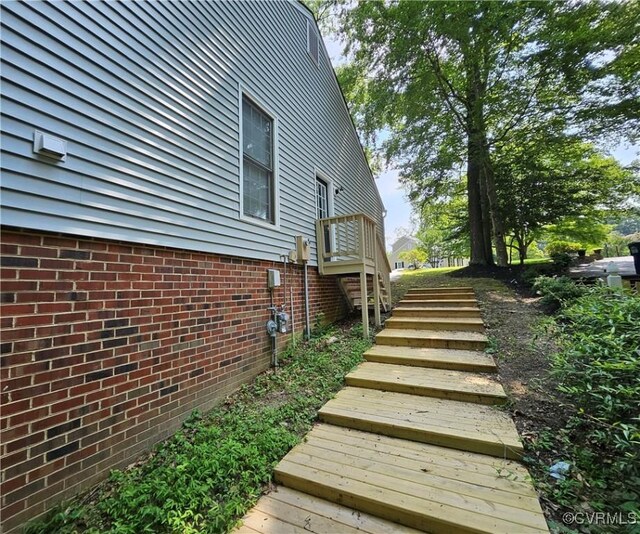 10278 Henderson Hall Rd, Mechanicsville, VA 20116 - view of home's exterior featuring stairs and brick siding