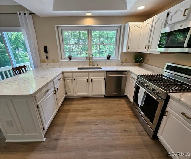 10278 Henderson Hall Rd, Mechanicsville, VA 23116 - kitchen with stainless steel appliances, a peninsula, white cabinets, and recessed lighting
