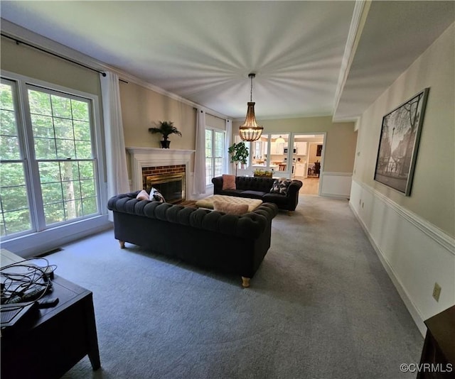 10278 Henderson Hall Rd, Mechanicsville, VA 20116 - living area with carpet floors, a chandelier, a fireplace, crown molding, and wainscoting
