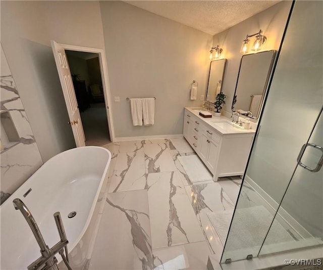 10278 Henderson Hall Rd, Mechanicsville, VA 20116 - bathroom featuring marble finish floors, double vanity, a soaking tub, a stall shower, and a textured ceiling
