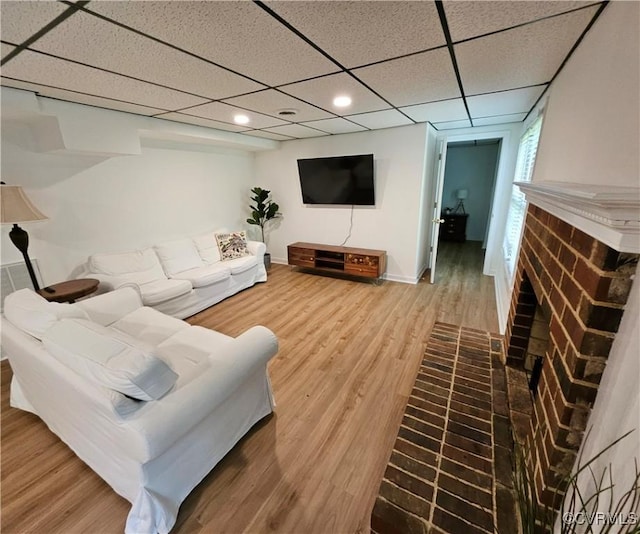 10278 Henderson Hall Rd, Mechanicsville, VA 20116 - living room with a brick fireplace, wood finished floors, recessed lighting, and a drop ceiling