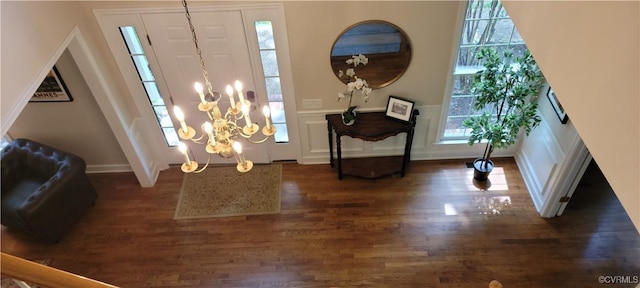 10278 Henderson Hall Rd, Mechanicsville, VA 23116 - foyer with dark wood-style floors, plenty of natural light, a decorative wall, a wainscoted wall, and a chandelier