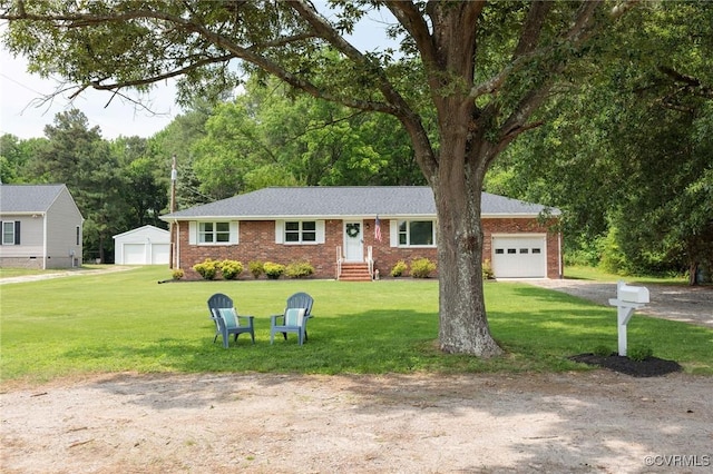 2000 Point Of Rocks Rd, Chester, VA 23836 - ranch-style home featuring brick siding, a front lawn, an outbuilding, and a detached garage