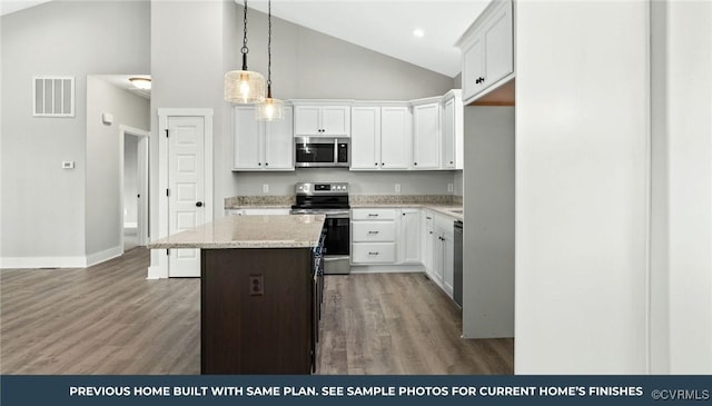 TBD Evans Creek Rd, Brodnax, VA 23920 - kitchen featuring appliances with stainless steel finishes, a kitchen island, wood finished floors, white cabinets, and high vaulted ceiling