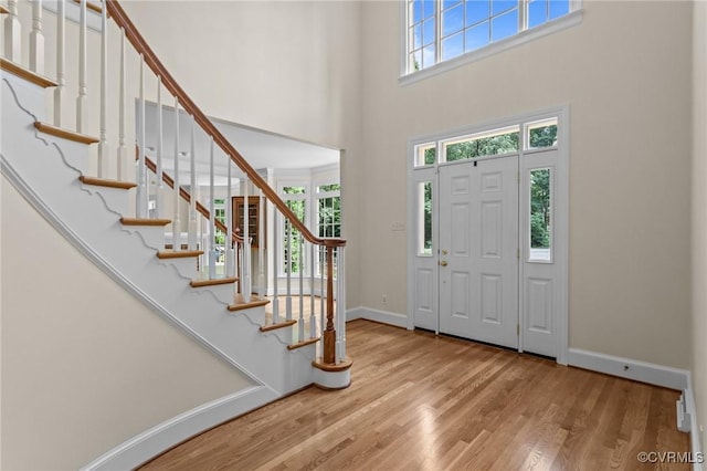 9261 Royal Grant Dr, Hanover, VA 23116 - foyer with a high ceiling, wood finished floors, and stairs