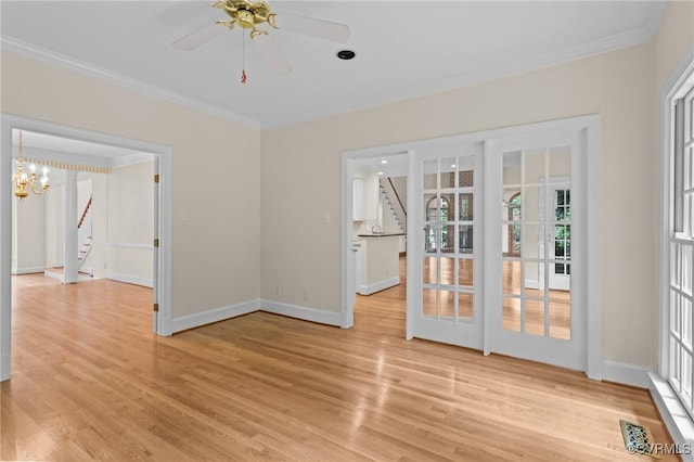 9261 Royal Grant Dr, Hanover, VA 23116 - unfurnished room with crown molding, stairway, light wood-style floors, ceiling fan, and a chandelier