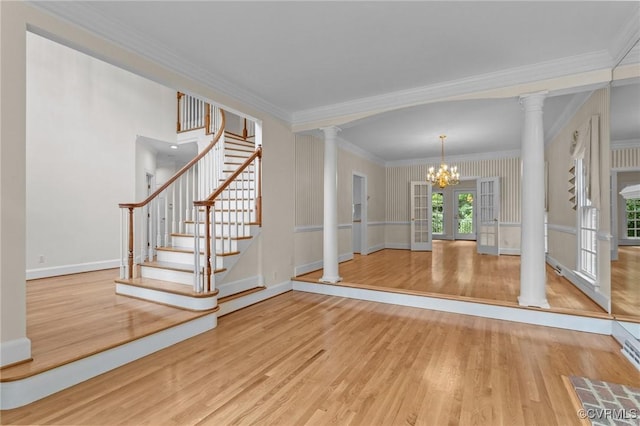 9261 Royal Grant Dr, Hanover, VA 23116 - foyer with ornate columns, a chandelier, wood finished floors, crown molding, and stairway