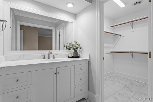 9261 Royal Grant Dr, Hanover, VA 23116 - bathroom featuring marble finish flooring, vanity, and a spacious closet