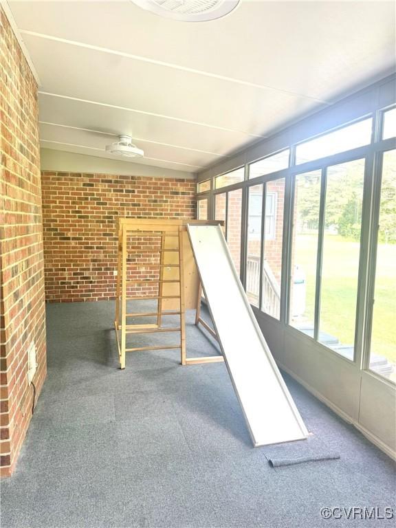 31368 Old Dawn Rd, Hanover, VA 23069 - basement featuring brick wall, plenty of natural light, and carpet floors
