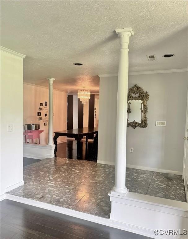 31368 Old Dawn Rd, Hanover, VA 23069 - kitchen with ornamental molding, a chandelier, ornate columns, and a textured ceiling