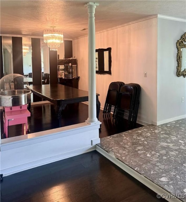 31368 Old Dawn Rd, Hanover, VA 23069 - kitchen with crown molding, a chandelier, wood finished floors, decorative columns, and a textured ceiling