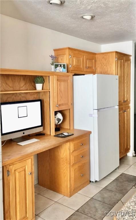31368 Old Dawn Rd, Hanover, VA 23069 - kitchen featuring freestanding refrigerator, light tile patterned floors, and a textured ceiling