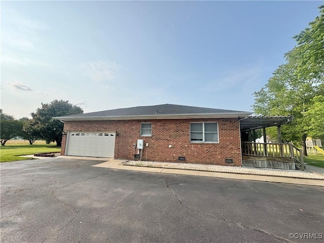 31368 Old Dawn Rd, Hanover, VA 23069 - view of property exterior featuring brick siding, driveway, crawl space, and a garage